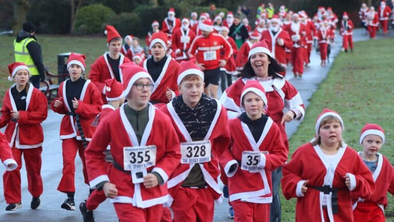 Jake Emms is raising money for Beacon Centre For The Blind The picture shows a man running in a Santa suit.